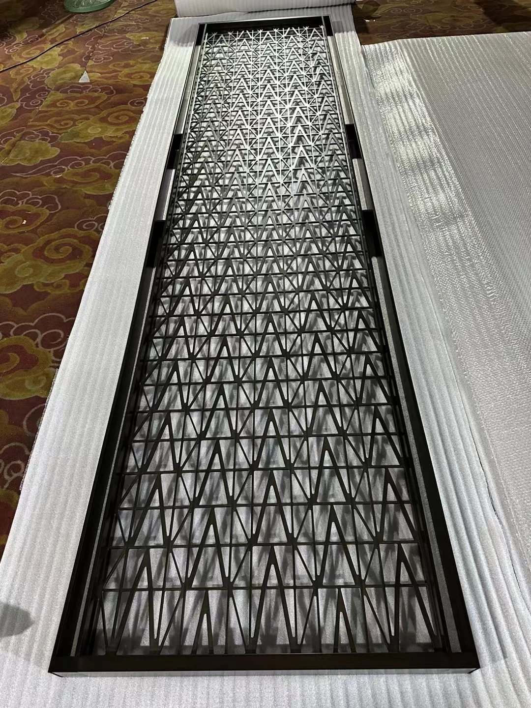 Laser-cut stainless steel screen with a custom decorative pattern 7